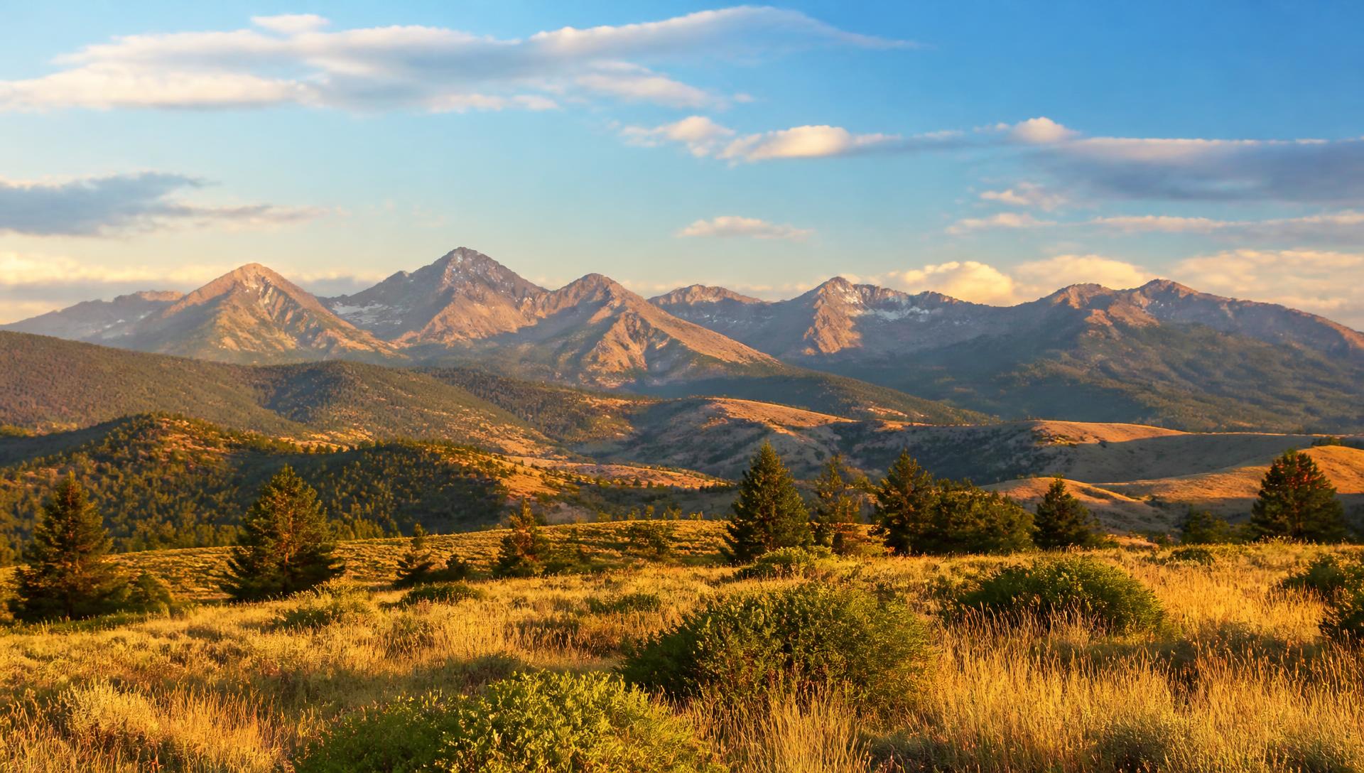 Snow-dusted Colorado Front Range peaks rising above golden foothills
